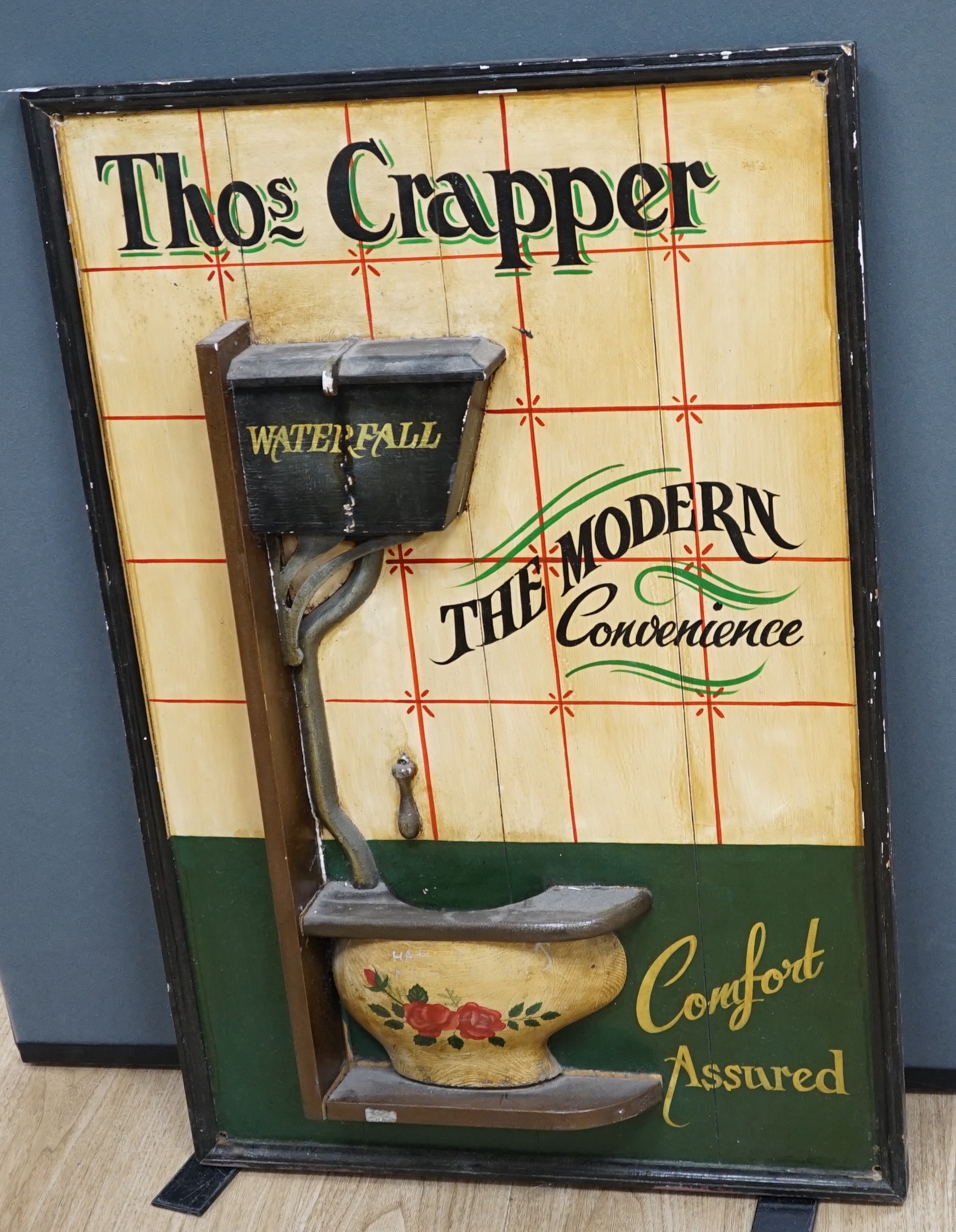 A ‘Thomas Crapper’ painted wood advertising sign, 91 x 61cm